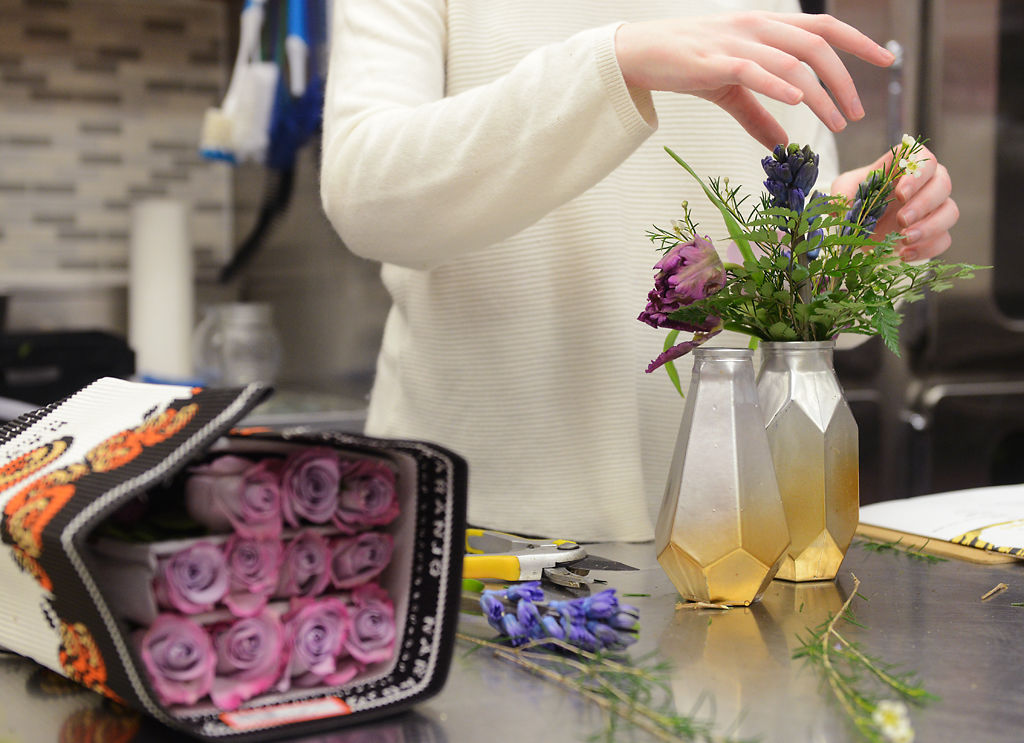 Amara Limberis creates a floral arrangement